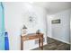 Bright and airy entryway with a console table and decorative mirror at 7511 Tyson Dr, Port Richey, FL 34668