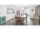 Charming dining room with wood table and chairs, and a hutch at 7511 Tyson Dr, Port Richey, FL 34668