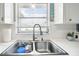 Modern double sink with a stylish faucet in the updated kitchen at 7511 Tyson Dr, Port Richey, FL 34668