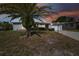 Single story home with a carport and palm tree at 7511 Tyson Dr, Port Richey, FL 34668