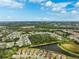 Aerial view of a residential neighborhood with a lake at 8520 Grand Alberato Rd, Tampa, FL 33647
