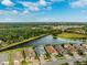 Aerial view of lakefront homes in a quiet community at 8520 Grand Alberato Rd, Tampa, FL 33647