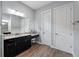 Bathroom with a large vanity, double sinks, and separate shower and tub at 8520 Grand Alberato Rd, Tampa, FL 33647