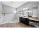 Elegant bathroom with a large walk-in shower and a double vanity at 8520 Grand Alberato Rd, Tampa, FL 33647