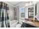 Clean bathroom with tub, shower, and granite countertop at 8520 Grand Alberato Rd, Tampa, FL 33647