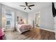 Charming bedroom with pink bedding and en-suite bathroom at 8520 Grand Alberato Rd, Tampa, FL 33647