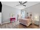 Bright bedroom featuring a pink bed and built-in vanity at 8520 Grand Alberato Rd, Tampa, FL 33647