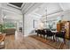 Elegant dining room with a large table, chandelier, and hardwood floors at 8520 Grand Alberato Rd, Tampa, FL 33647