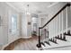 Light and spacious entryway with hardwood floors and staircase at 8520 Grand Alberato Rd, Tampa, FL 33647