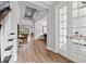 Bright entryway with hardwood floors and view to living areas at 8520 Grand Alberato Rd, Tampa, FL 33647