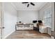 Spacious home office with built-in shelving and wood flooring at 8520 Grand Alberato Rd, Tampa, FL 33647