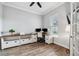 Bright home office with built-in shelving and wood flooring at 8520 Grand Alberato Rd, Tampa, FL 33647
