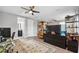 Modern home office with built-in shelving and a view of the bathroom at 8520 Grand Alberato Rd, Tampa, FL 33647