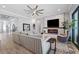 Bright living room with a cozy seating area and fireplace, offering an open floor plan at 8520 Grand Alberato Rd, Tampa, FL 33647