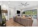 Spacious living room with a fireplace, large windows, and pool view at 8520 Grand Alberato Rd, Tampa, FL 33647