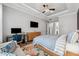 Main bedroom with a workspace, a large bed, and a sitting area at 8520 Grand Alberato Rd, Tampa, FL 33647