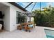 Outdoor patio with wooden table and seating at 8520 Grand Alberato Rd, Tampa, FL 33647