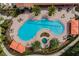 Community pool and spa with lounge areas at 8520 Grand Alberato Rd, Tampa, FL 33647