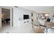 Open living room with sectional sofa and bedroom view at 9 Haig Pl # 703, Dunedin, FL 34698