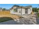 Newly renovated home with a spacious backyard and detached garage at 1001 E New Orleans Ave, Tampa, FL 33603
