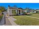 Charming craftsman style home with a front porch and well-manicured lawn at 1001 E New Orleans Ave, Tampa, FL 33603