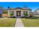 White and black craftsman home with a front porch and landscaped yard at 1001 E New Orleans Ave, Tampa, FL 33603
