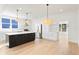 Modern kitchen with island, stainless steel appliances, and white shaker cabinets at 1001 E New Orleans Ave, Tampa, FL 33603