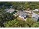 Aerial view showcasing a renovated home with a fenced yard in a residential neighborhood at 1001 E New Orleans Ave, Tampa, FL 33603