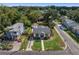 Aerial view of a renovated home with a driveway and fenced yard at 1001 E New Orleans Ave, Tampa, FL 33603