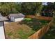 Large backyard with detached garage and wooden fence at 1001 E New Orleans Ave, Tampa, FL 33603
