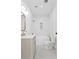 Modern bathroom with white hex tile, freestanding tub, and updated vanity at 1001 E New Orleans Ave, Tampa, FL 33603
