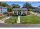 Recently renovated home with a fenced yard and driveway at 1001 E New Orleans Ave, Tampa, FL 33603