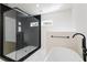 Spa-like bathroom with a large walk-in shower and soaking tub at 1001 E New Orleans Ave, Tampa, FL 33603