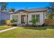 Newly renovated craftsman home with white siding, black trim, and landscaping at 1001 E New Orleans Ave, Tampa, FL 33603