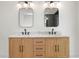 Bathroom with double vanity and modern light fixtures at 1001 E New Orleans Ave, Tampa, FL 33603