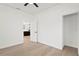 Bedroom with hardwood floors and kitchen access at 1001 E New Orleans Ave, Tampa, FL 33603