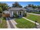 Newly renovated home exterior featuring a modern design and landscaped yard at 1001 E New Orleans Ave, Tampa, FL 33603