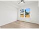Bright bedroom featuring light wood floors and large windows at 1001 E New Orleans Ave, Tampa, FL 33603