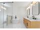 Modern bathroom with double vanity and hexagon tile floor at 1001 E New Orleans Ave, Tampa, FL 33603