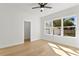 Bright bedroom with hardwood floors and backyard view at 1001 E New Orleans Ave, Tampa, FL 33603