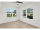 Bright bedroom with hardwood floors and neighborhood view at 1001 E New Orleans Ave, Tampa, FL 33603
