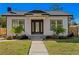 Charming craftsman style home with a well-manicured lawn at 1001 E New Orleans Ave, Tampa, FL 33603