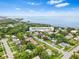 Aerial view of a house near the water, showcasing the neighborhood and waterfront at 1005 Greenleaf Way, Tarpon Springs, FL 34689