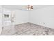 Dining room with wood-look tile floor and access to kitchen at 1005 Greenleaf Way, Tarpon Springs, FL 34689