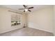 Spacious bedroom with ceiling fan and large window at 12320 Ballentrae Forest Dr, Riverview, FL 33579