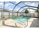 Inviting screened pool with ample deck space for lounging at 12320 Ballentrae Forest Dr, Riverview, FL 33579