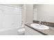 Clean bathroom with tub, granite countertop, and vanity at 13423 Crest Lake Dr, Hudson, FL 34669