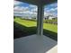 View of the backyard featuring a lush green lawn and neighborhood view at 16021` 7Th E Ave, Bradenton, FL 34212