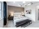 Main bedroom with a plush bed, accent wall, and plenty of natural light at 18840 Indian Rock Pl, Lakewood Ranch, FL 34211