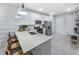 Modern kitchen with white shaker cabinets and stainless steel appliances at 18844 Indian Rock Pl, Lakewood Ranch, FL 34211